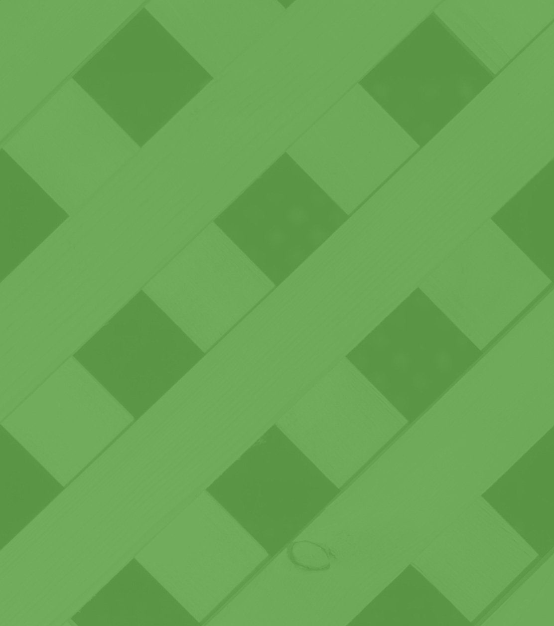 Green-toned image of a crisscross lattice fence pattern made of diagonal wooden slats.